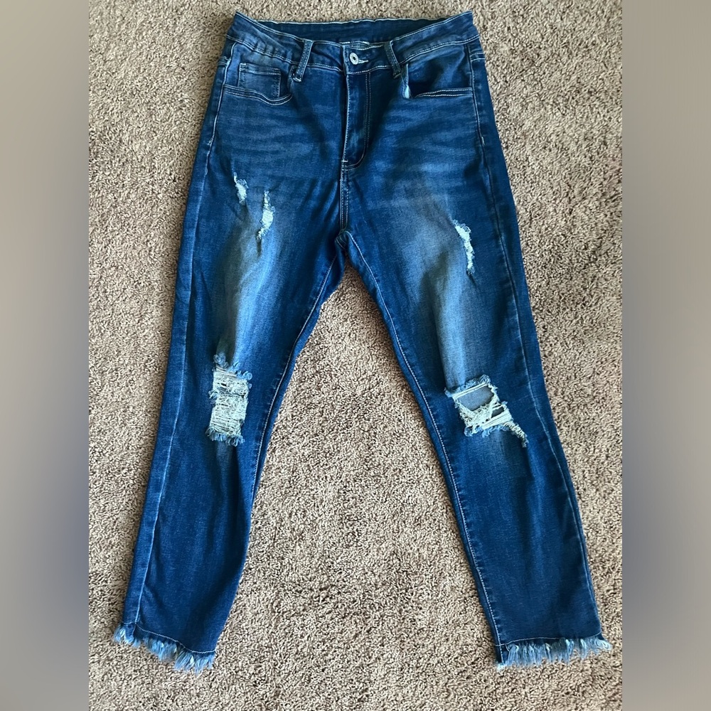 Boutique brand distressed jeans with frayed hem